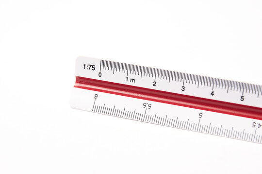 Scale ruler close up, tool for precise measuring and to change scales, also called escal&iacute;metro used by engineers and architects isolated on white