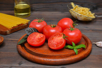 ripe tomatoes and pasta, ingredients for making spaghetti sauce
