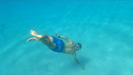 young man snorkeling in Menorca 