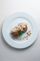 Menu for the restaurant: beef medallions with mushroom sauce.