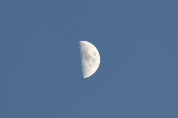 Obraz na płótnie Canvas Crescent moon by day.