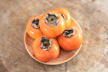 A plate of delicious red persimmons