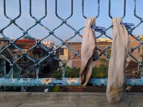 Drying Dirty Wet Socks In The Morning