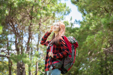 Hiker with backpack Woman hiking in autumn nature. Leisure activity outdoors