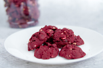 Red velvet cookies with background decoration. Selective focus.