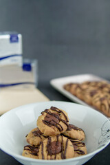 Chocolate thumbprint cookies with background decoration. Selective focus.