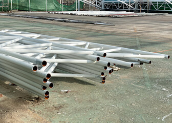 The steel structure white paint placed on ground. For building construction in the outdoor.