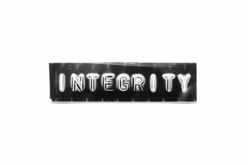 Embossed letter with word integrity in black banner on white paper background