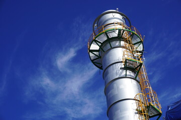 Stack of gas turbine power plant is part of the chemical production process at olefin factory.