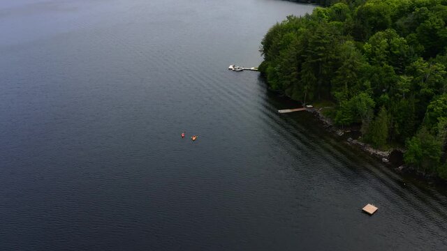 Overhead drone video of two kayakers on an Ontario lake