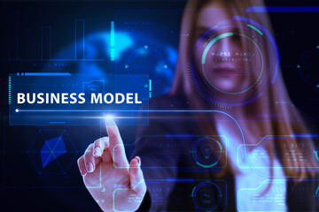 Business, Technology, Internet and network concept. Young businessman working on a virtual screen of the future and sees the inscription: Business model