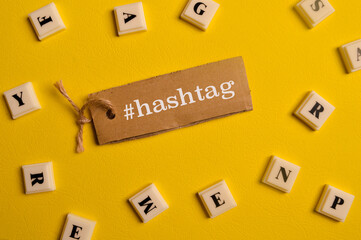 Alphabet letters and label tag written with #hashtag
