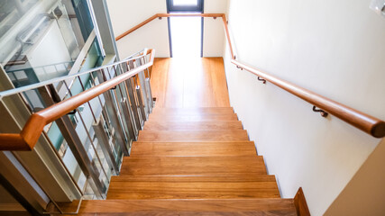 Steel staircase decorated with teak wood. Concept for design, interior and construction.