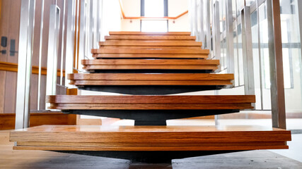 Steel staircase decorated with teak wood. Concept for design, interior and construction.