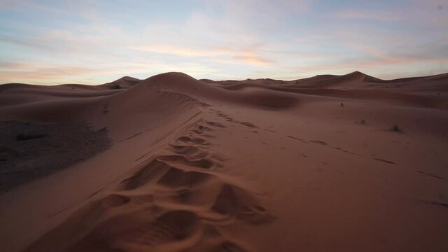 Aerial View Of Sahara Desert Sand Dunes At Sunrise. With Footprints In It