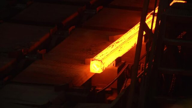 Production of steel and heavy metals in an electric furnace in production. Industrial Machinery and Metal Casting plant. Hot steel billets continuous casting at a metallurgical plant


