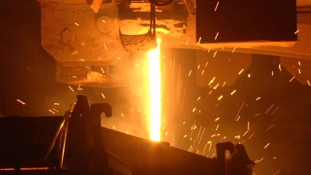 Continuous casting process. Steel production in the workshop. Hot steel pouring in steel plant.
