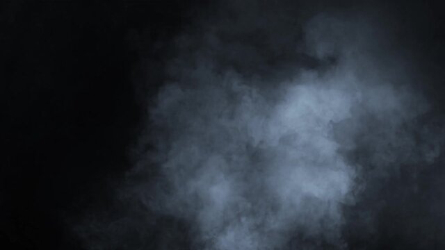 Smoke, Cloud of cold fog in light spot background. Abstract white smoke in slow motion.