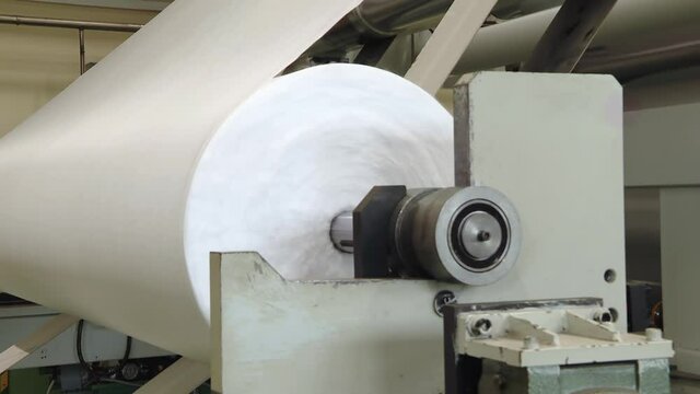 Weaving machines of the cotton factories. Production of textiles. sewing equipment, loom. Equipment at a garment factory.
