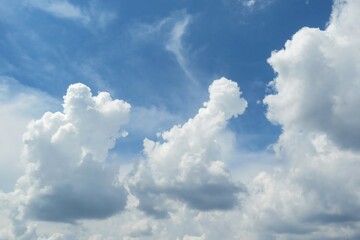Naklejka na ściany i meble Big fluffy clouds in the sky