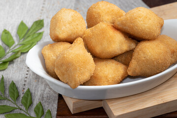 A portion of Brazilian snack coxinha of chicken.