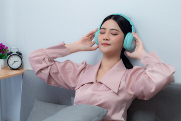 woman listening to music with headphones