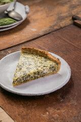 Quiche with spinach - traditional dish of french cuisine. Spinach  tart