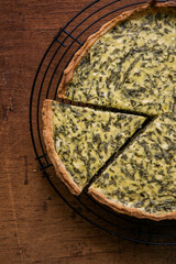 Quiche with spinach - traditional dish of french cuisine. Spinach  tart