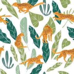 Leopard or cheetah hiding in lush monstera leaves