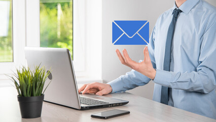 Businessman hand holding e-mail icon, Contact us by newsletter email and protect your personal...