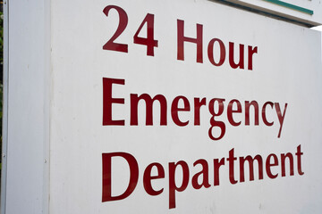 24 hour  hospital emergency department sign