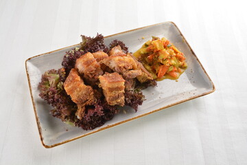 deep fried crispy pork belly crawling with nonya achar salad asian roasted menu