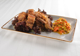 deep fried crispy pork belly crawling with nonya achar salad asian roasted menu