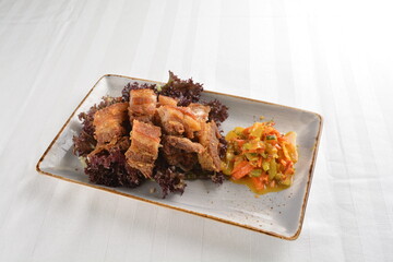 deep fried crispy pork belly crawling with nonya achar salad asian roasted menu