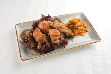 deep fried crispy pork belly crawling with nonya achar salad asian roasted menu