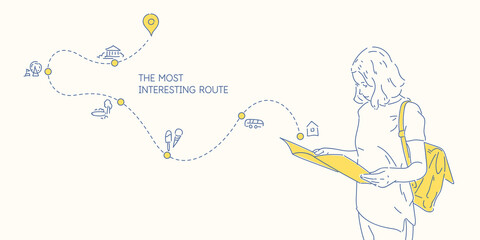 The girl plans the route of the trip. A young woman looks at the map.