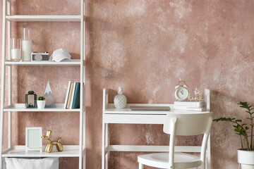 Interior of stylish room with modern workplace and book shelf