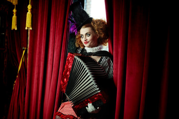 clown girl playing accordion © Andrey Kiselev