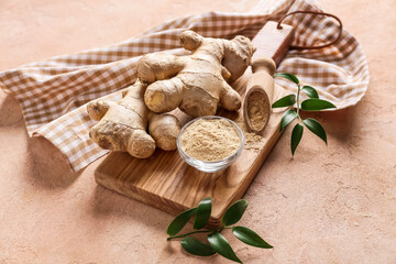 Ginger powder and roots on color background