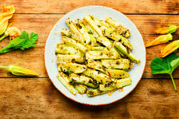 Roasted zucchini sticks with greens