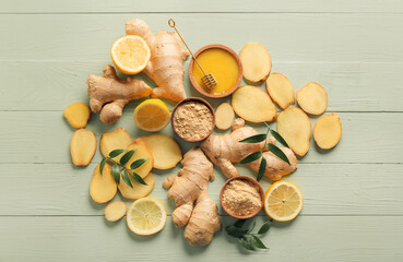 Ginger powder, honey and lemon on color wooden background