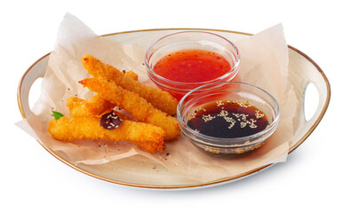 Deep fried shrimps with sauce on plate isolated on white
