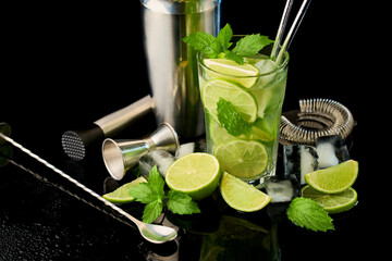 Glass of Fresh Mojito Cocktail - studio shot on black background