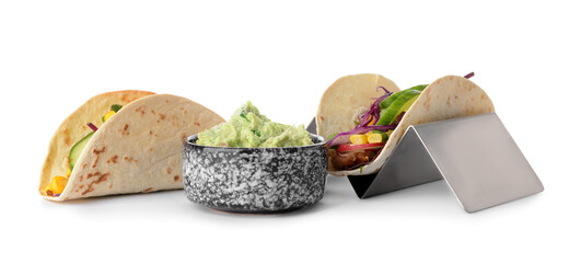 Stand with tacos and tasty guacamole in bowl on white background