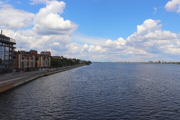 Voronezh cityscape with the reservoir, embankment and blue sky. Voronezh city quay on a summer day