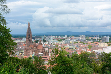 Freiburg im Breisgau, June 29, 2021: A storm front forms over the Rhine Valley and the city of Freiburg with the minster over the roofs of the old town.