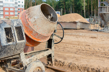 Industrial concrete mixer at a construction site. Preparation of concrete and mortar.