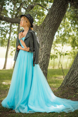 Fototapeta premium Elegant European bride in turquoise dress, fancy bridal collection, dress for wedding