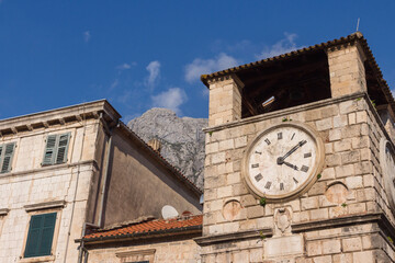 Fototapeta na wymiar Historic clock tower in the Old Town of Kotor. Montenegro 