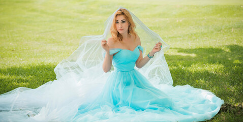 Fototapeta na wymiar Elegant European bride in turquoise dress, fancy bridal collection, dress for wedding